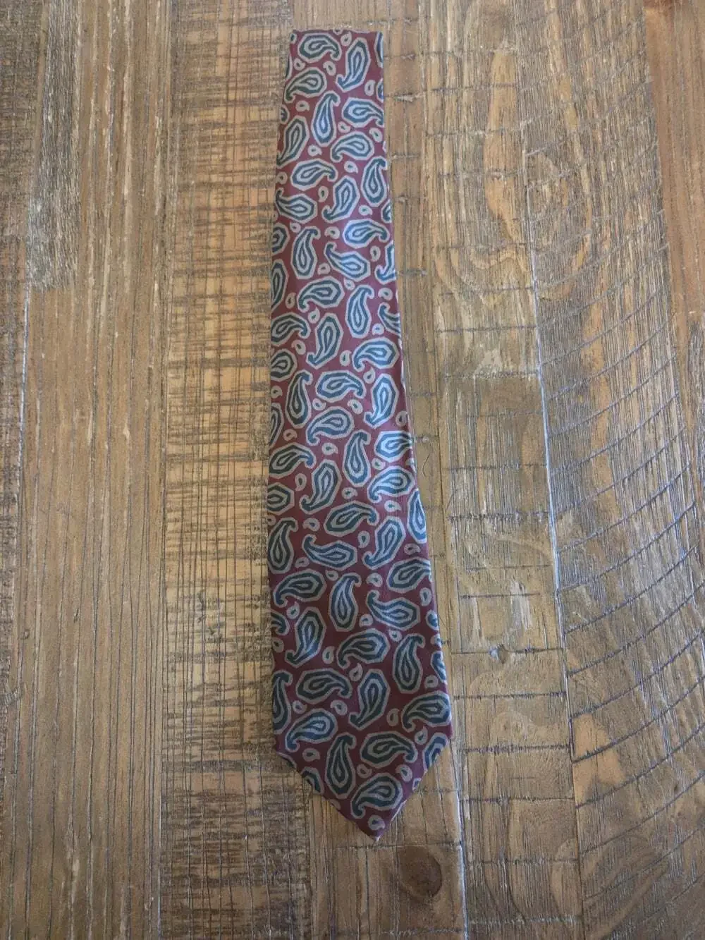 Pure Silk Made In Italy Burgundy necktie Nick Hilton Collection featuring a blue